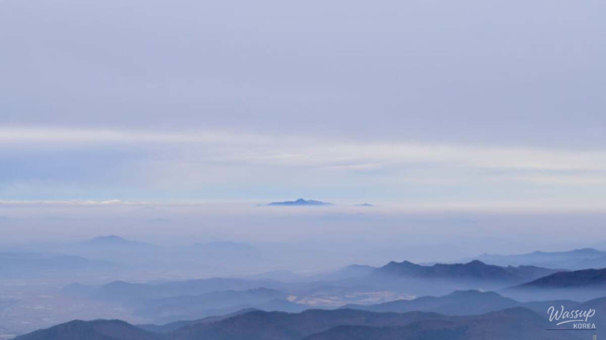 Visitors exploring resonant stones that produce bell-like sounds at Man-eo Temple