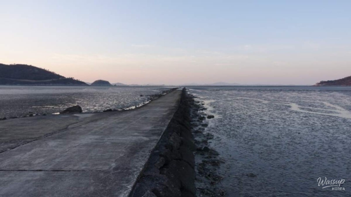 Driving view across Imjado Bridge with sea and tidal flats below