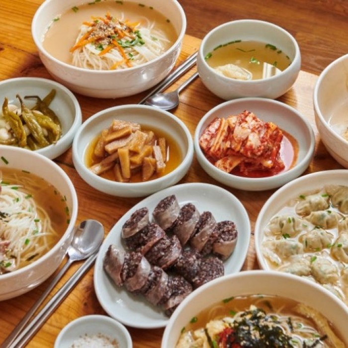 Warm local restaurant atmosphere discovered during a food-focused trip to Jeju