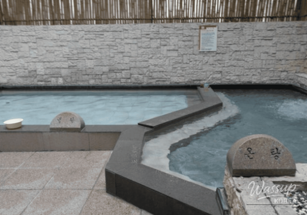 Outdoor hot spring bath at Onsu-gol in Suwon with winter steam rising