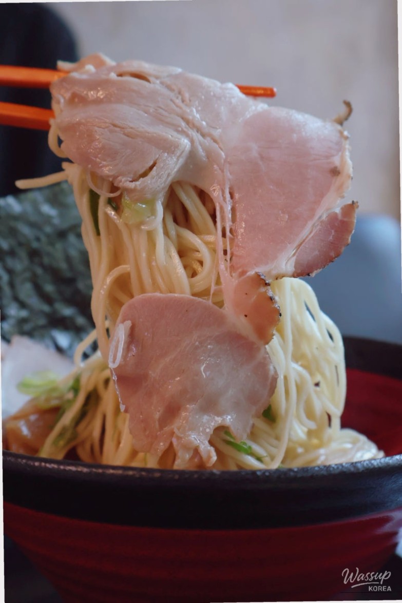 Self-order kiosk and seating layout at Uchu Jin Ramen in Euljiro