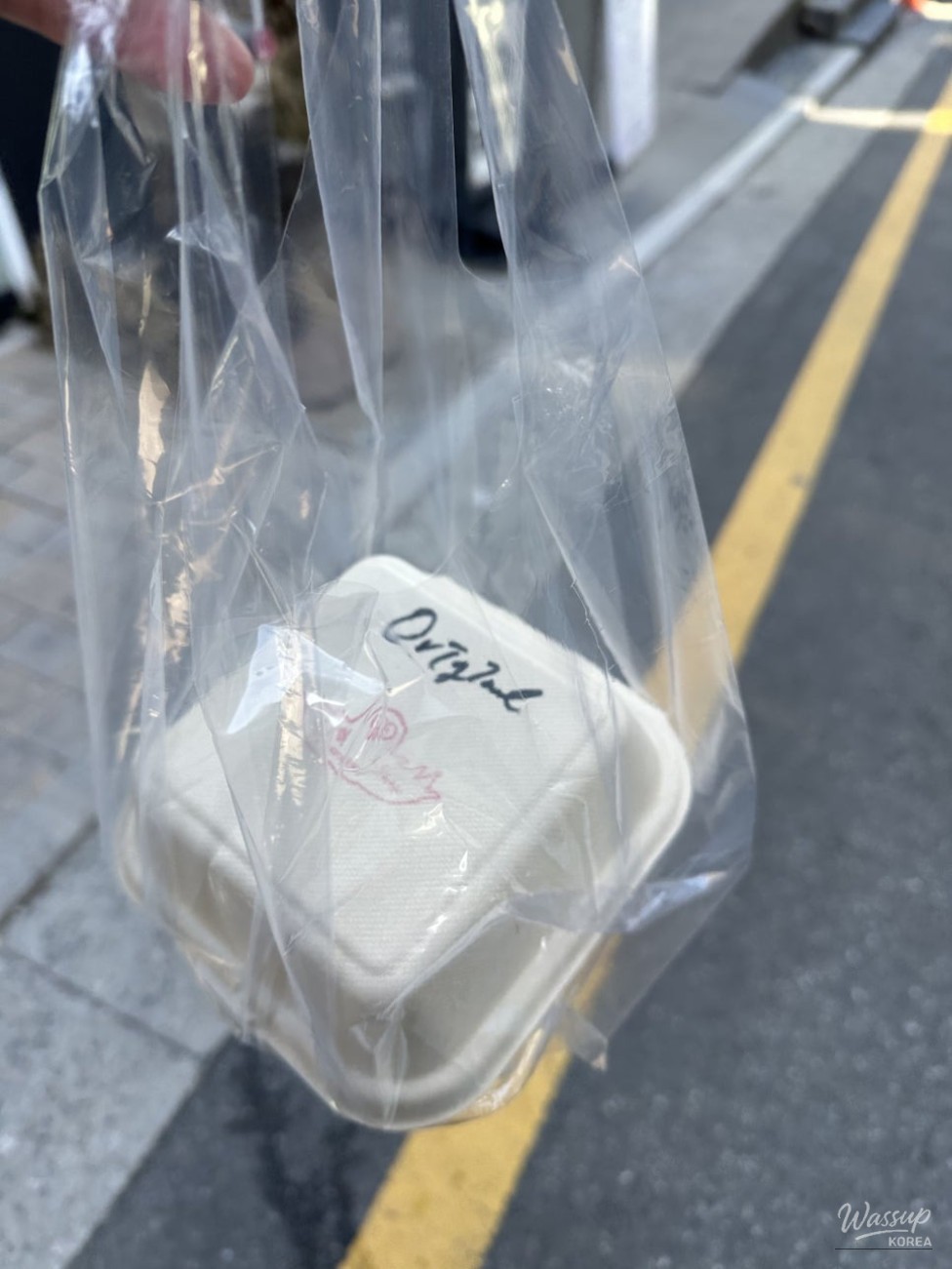 Dessert counter display at Tkii showcasing assorted cake slices