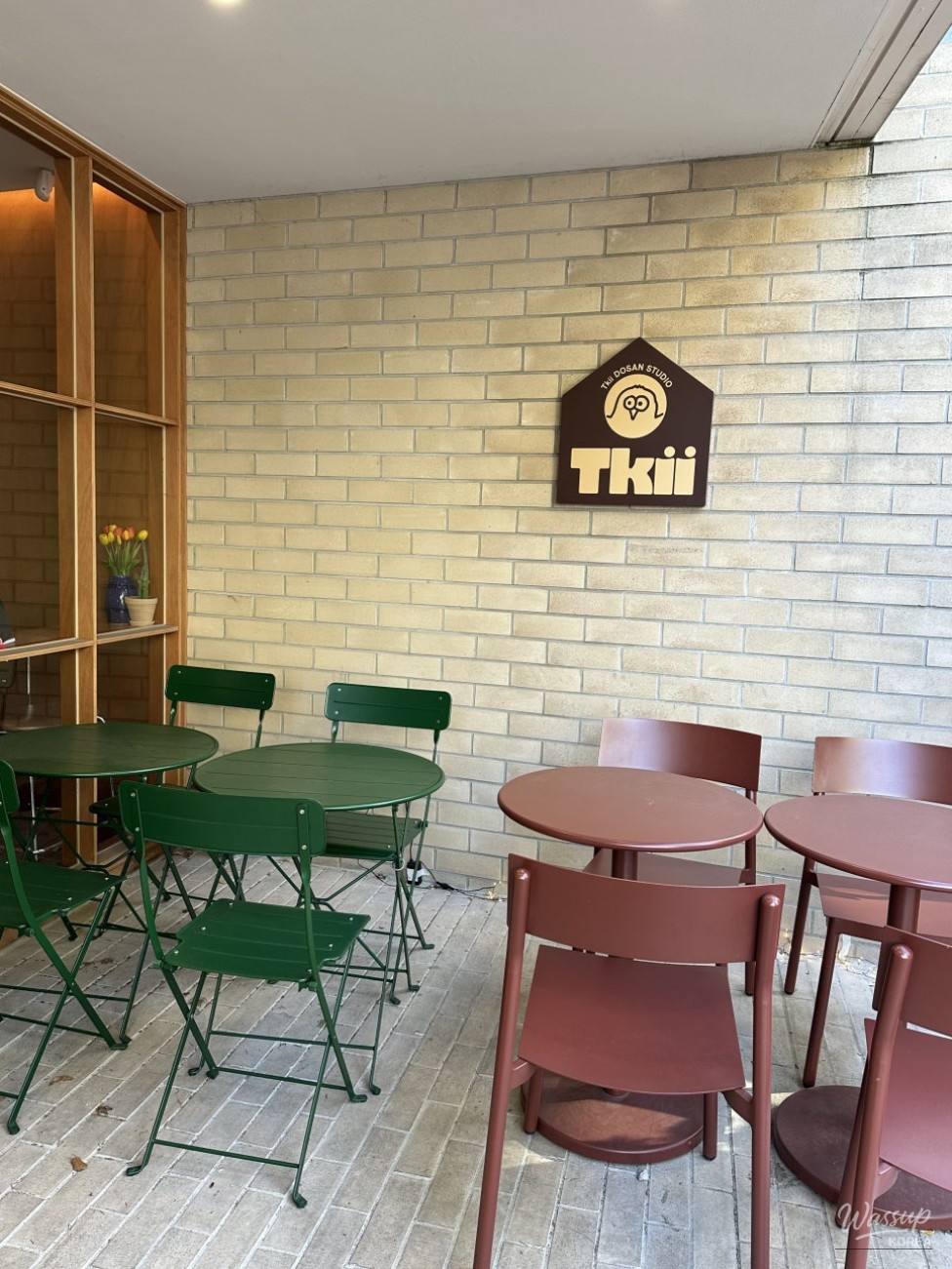 Interior seating area of Tkii with customers enjoying desserts during a weekday afternoon