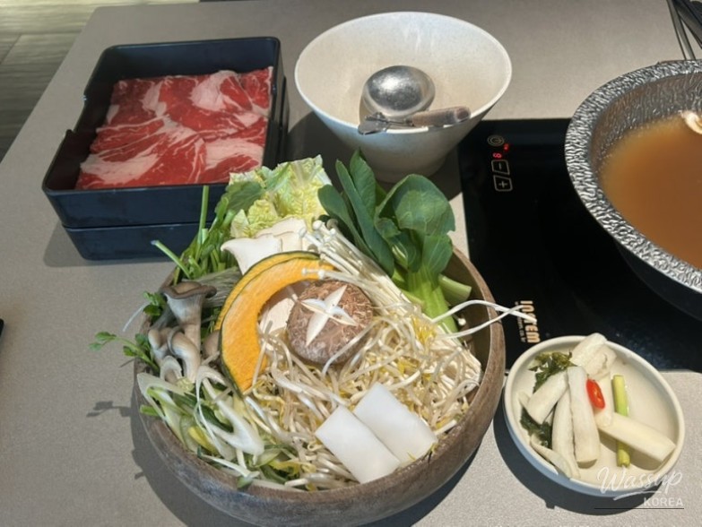 Table setting and dining atmosphere at Shabu In Seoul Apgujeong Rodeo Branch