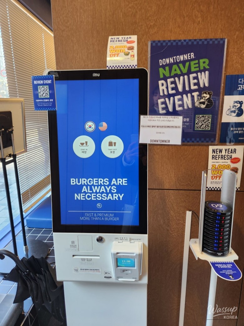 Hot and Sour Chicken Avocado Burger with salad and onion rings at Downtowner
