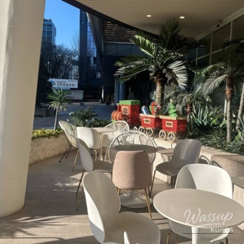 Warm exterior and dessert display at La Avenue cafe in Seongsu