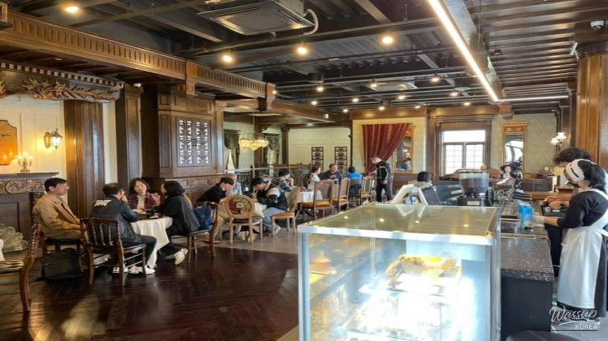 Sunshine Studio illuminated at night with soft yellow streetlights and historic building silhouettes