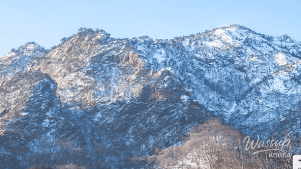 Panoramic winter view from Seoraksan cable car summit overlooking mountains and the East Sea