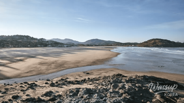 Red sedimentary cliffs and winter sea scenery at Jeokbyeokgang