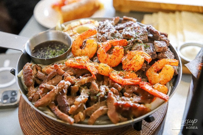 Friends enjoying a relaxed Western dining experience together in Masan