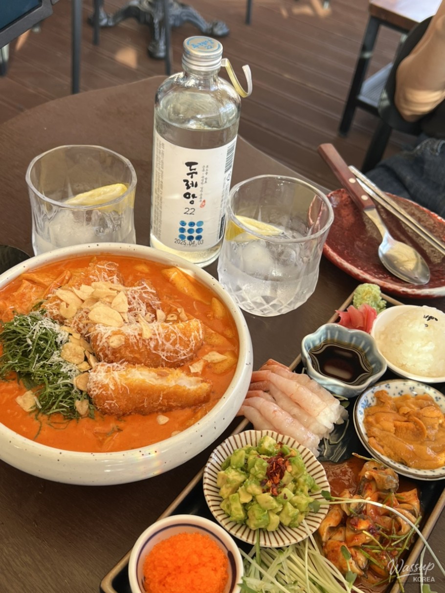 Rooftop terrace seating at Uya Jae with an open view toward Namsan Tower