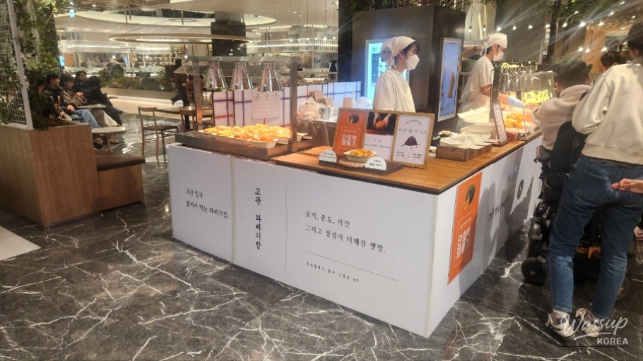 Customers lining up at popular dessert pop-ups inside Hyundai Daegu Food Hall