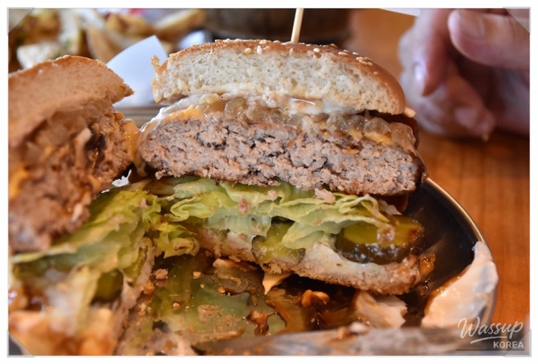 Selection of classic, garlic, and cheese fries served as side dishes with handmade burgers