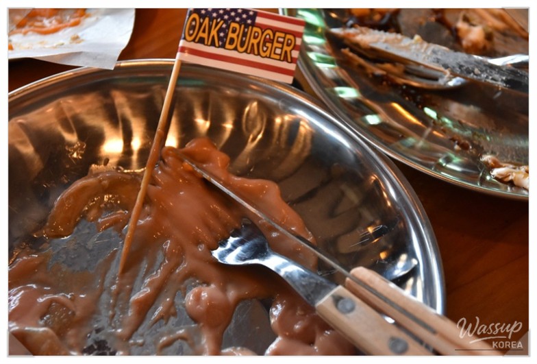 Garlic fries and cheese fries paired with a handmade Jeju black pork burger