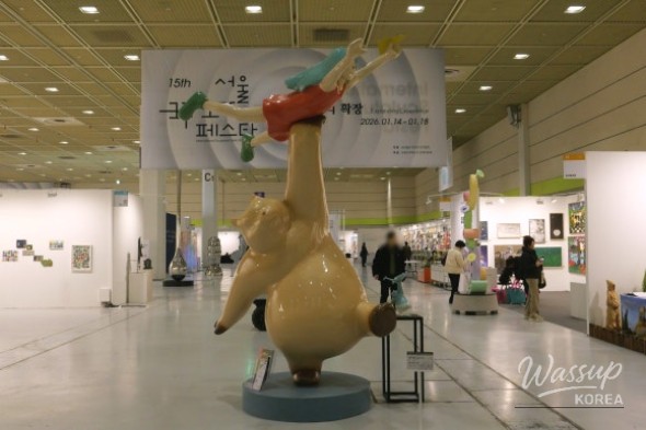 Side view of FAT PET - A Walk sculpture showing aluminum and stainless steel materials