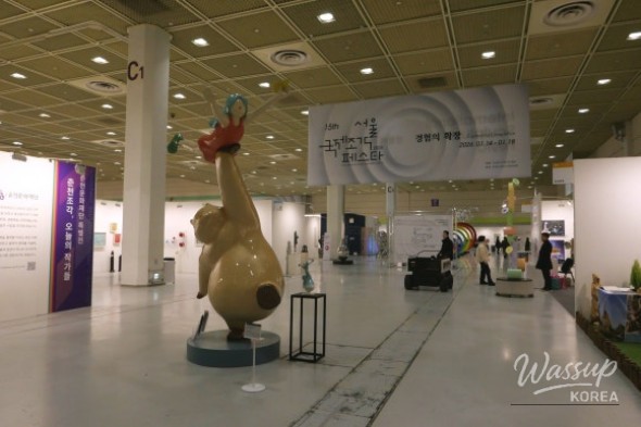 Audience-scale perspective of FAT PET sculpture emphasizing its large dimensions