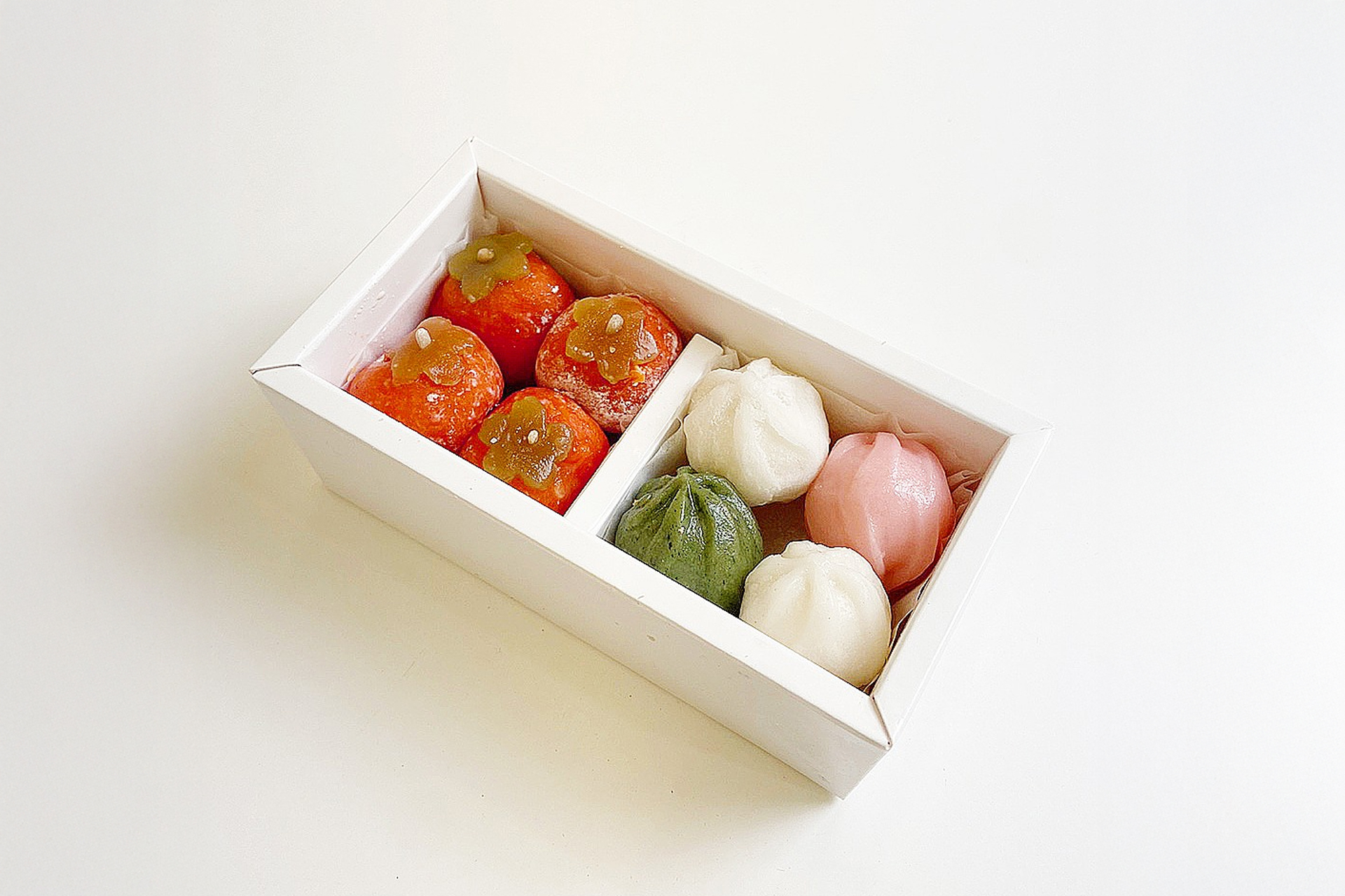 The traditional and inviting storefront of the Original Gongju Rice Cake Shop in Baekmigo-eul