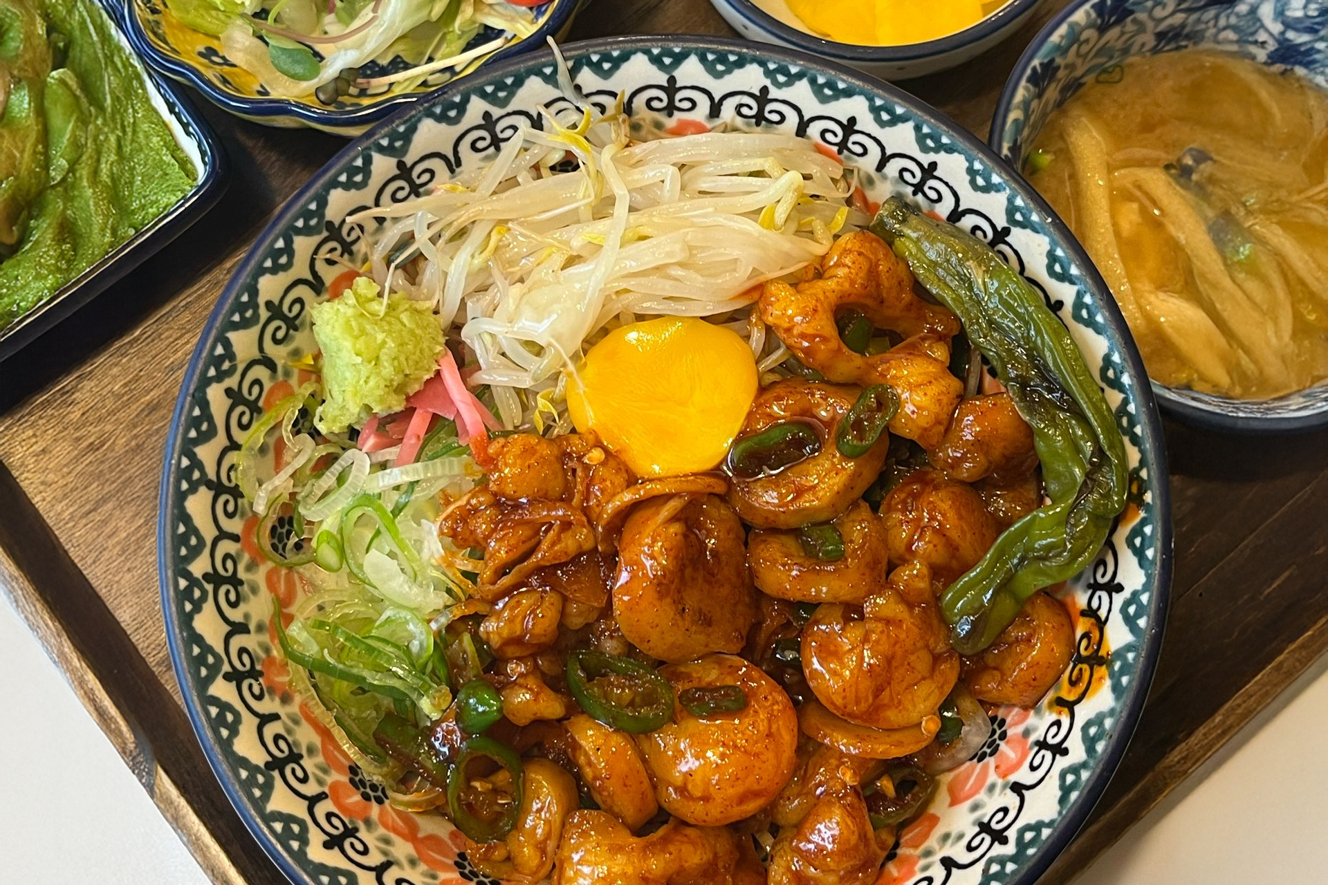 A beautifully presented steak rice bowl with colorful side dishes at Midoin Hongdae