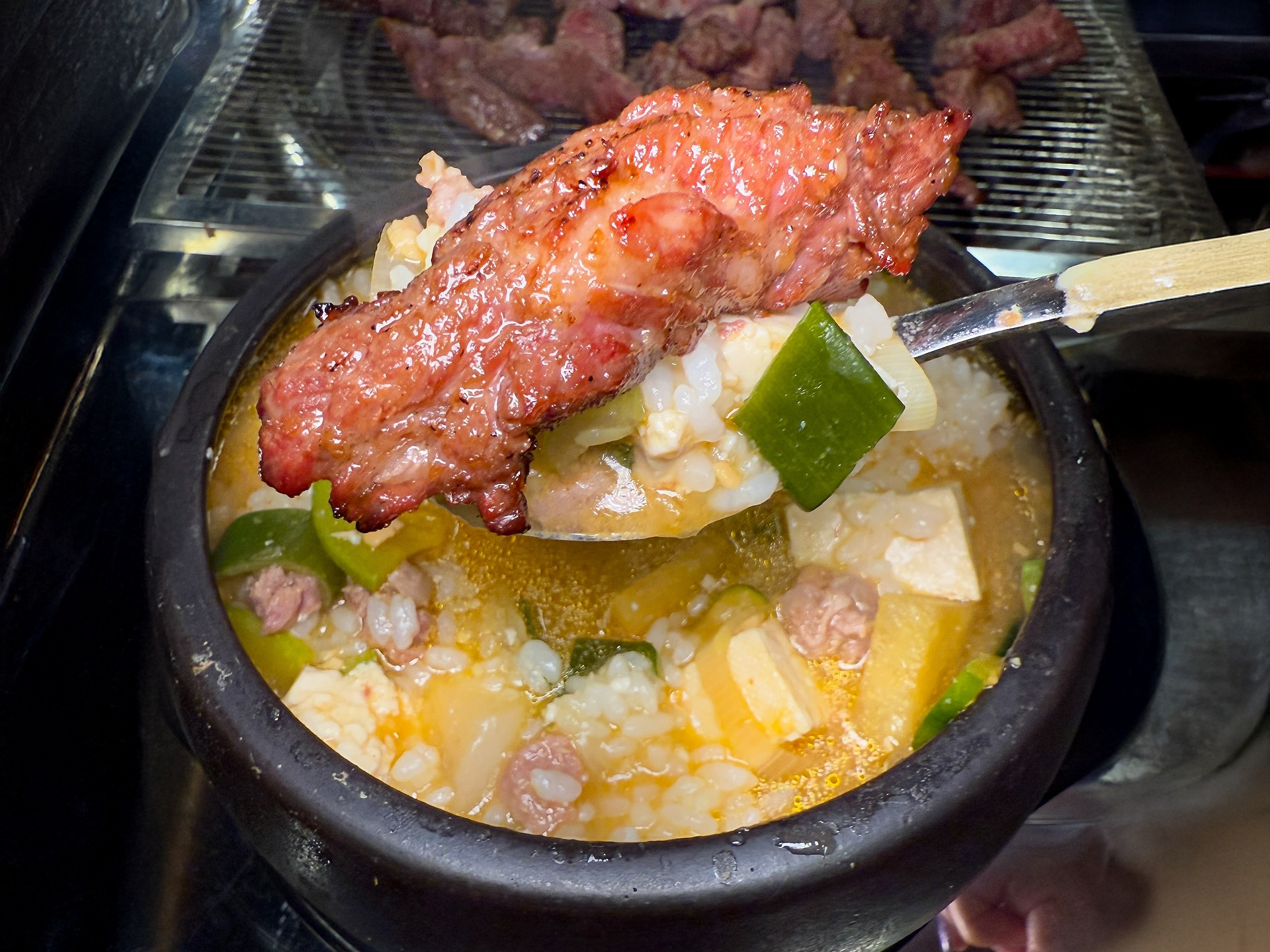 Side dishes and vegetables served with pork belly at Chobul House Euljiro