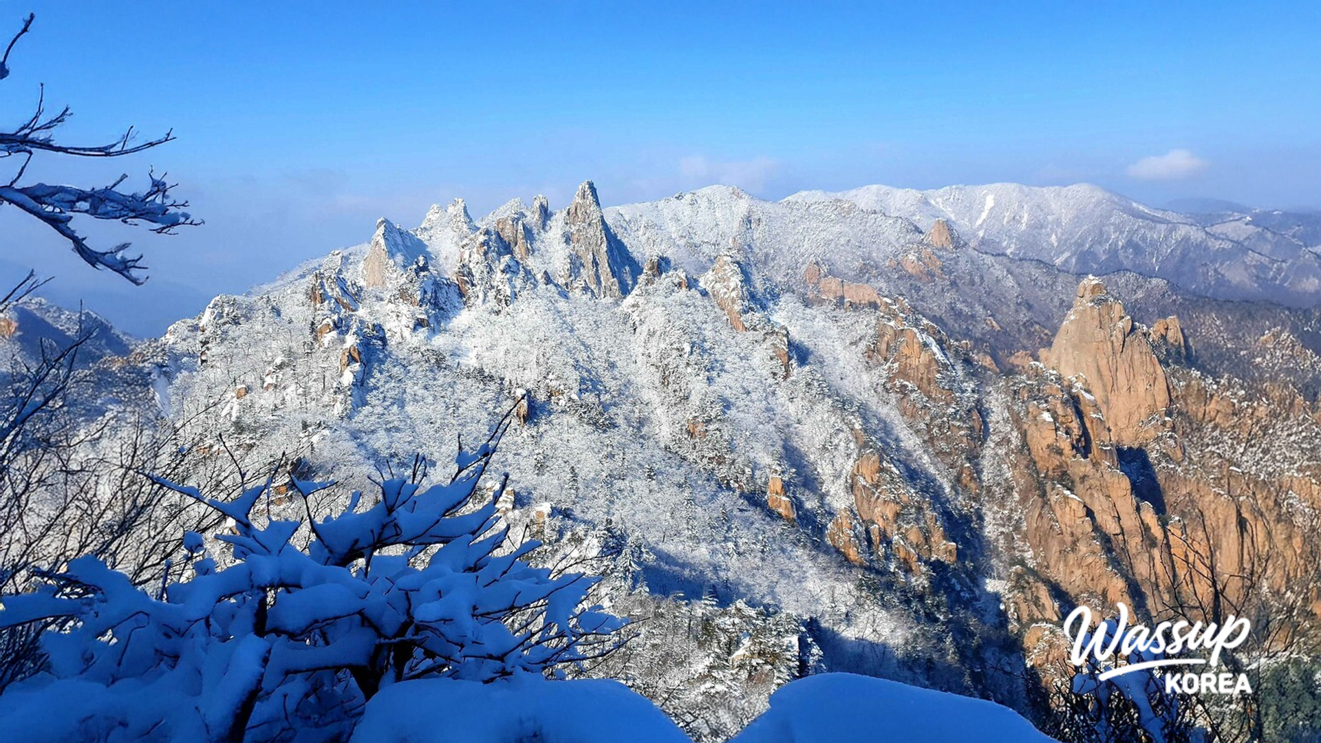 Hikers walking towards the snowy peak of Deogyusan National Park