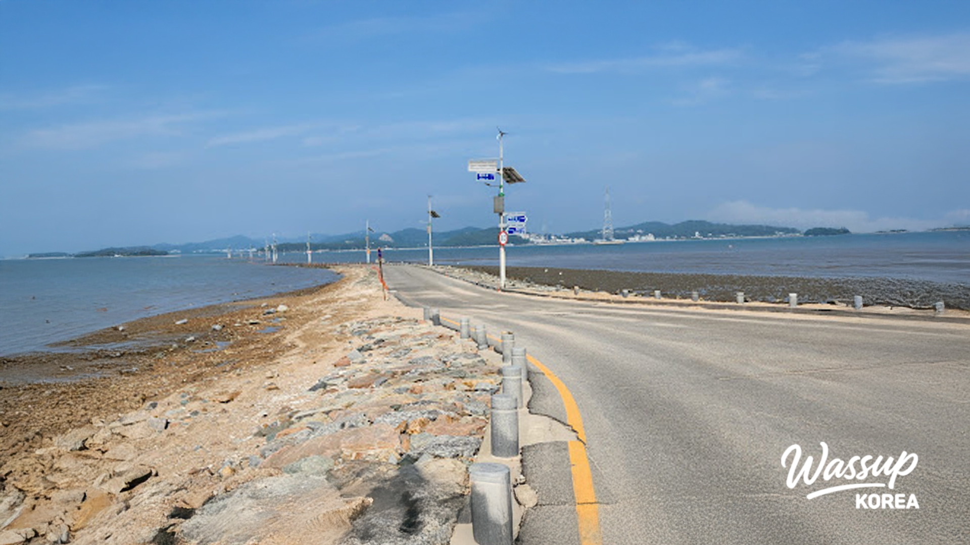 A scenic winter night drive capturing city lights and the sea view