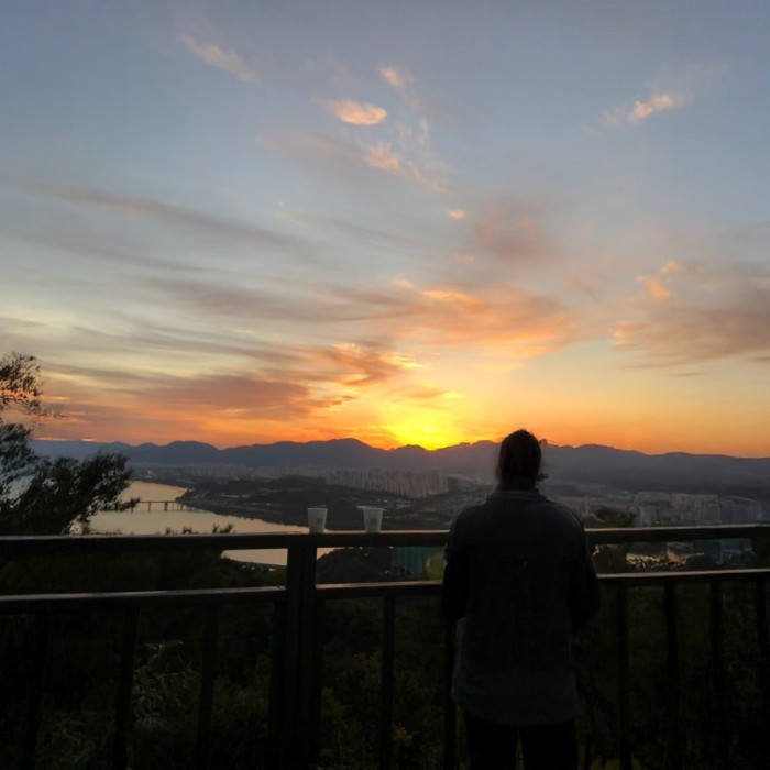 A breathtaking golden sunrise over the Han River viewed from a Seoul mountain peak