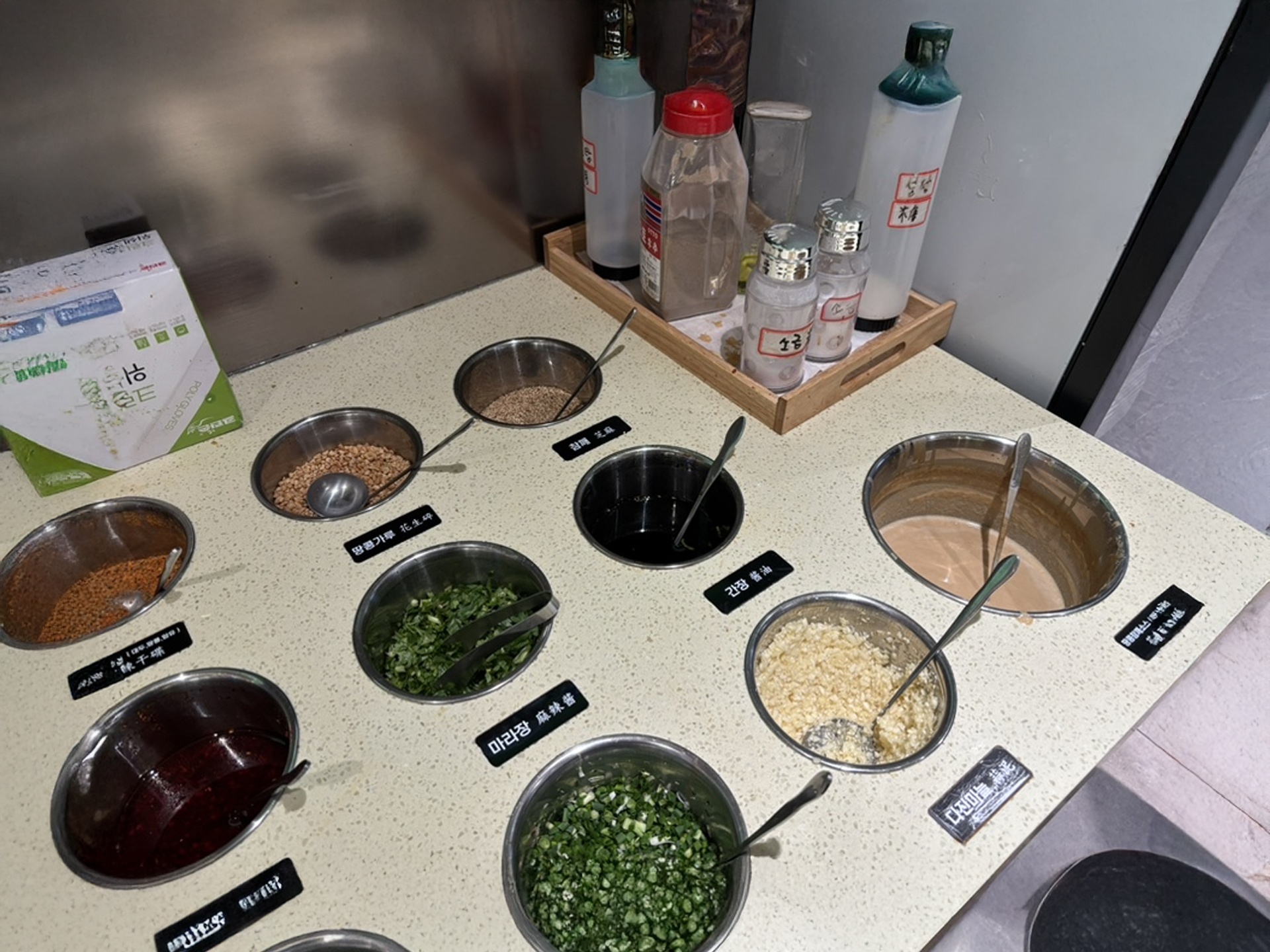 Interior view of Sang Sang Lao showing spacious seating and the modern QR code ordering system