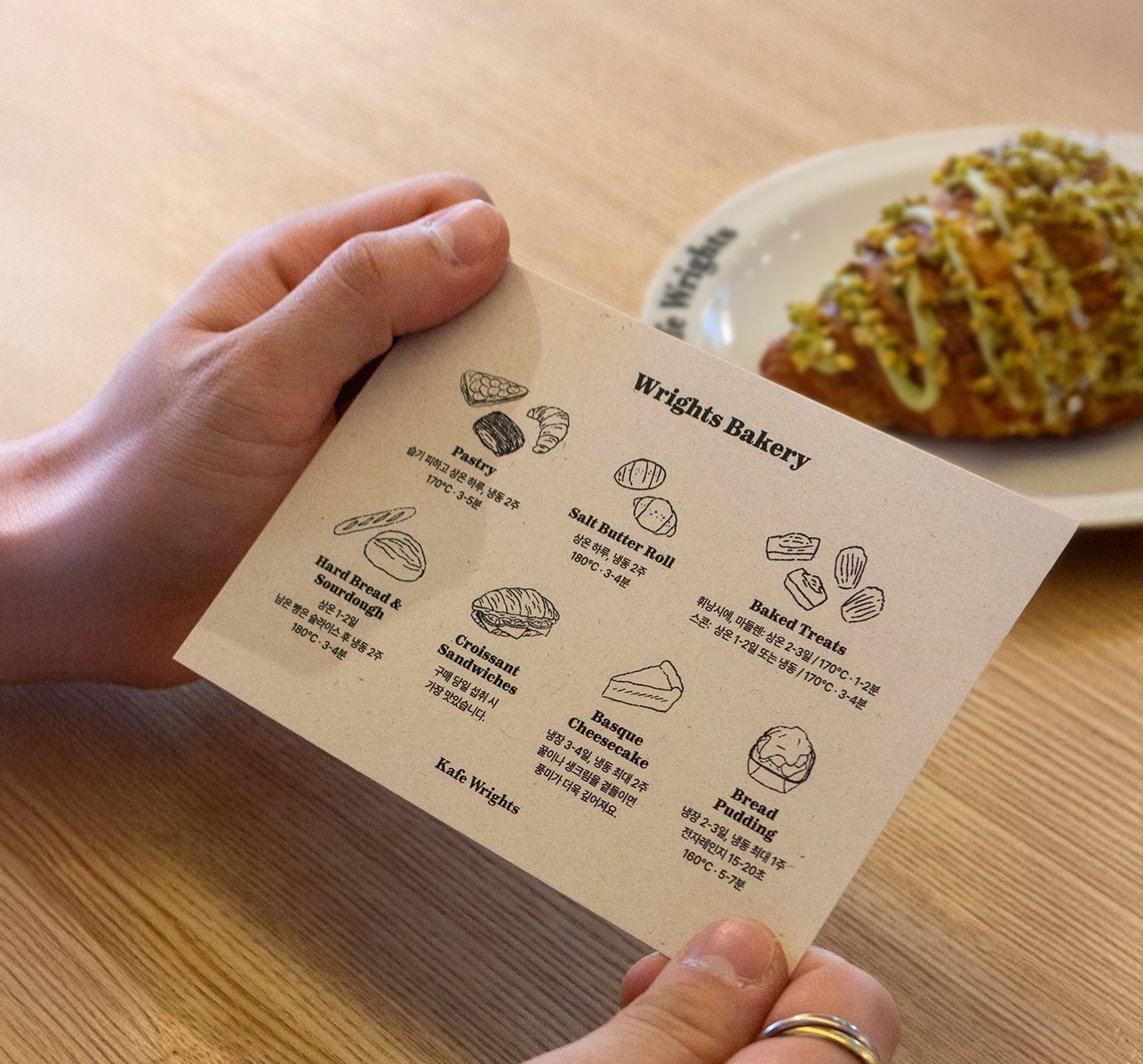 A variety of freshly baked pastries including croissants and egg tarts on display at Kcafe Wrights