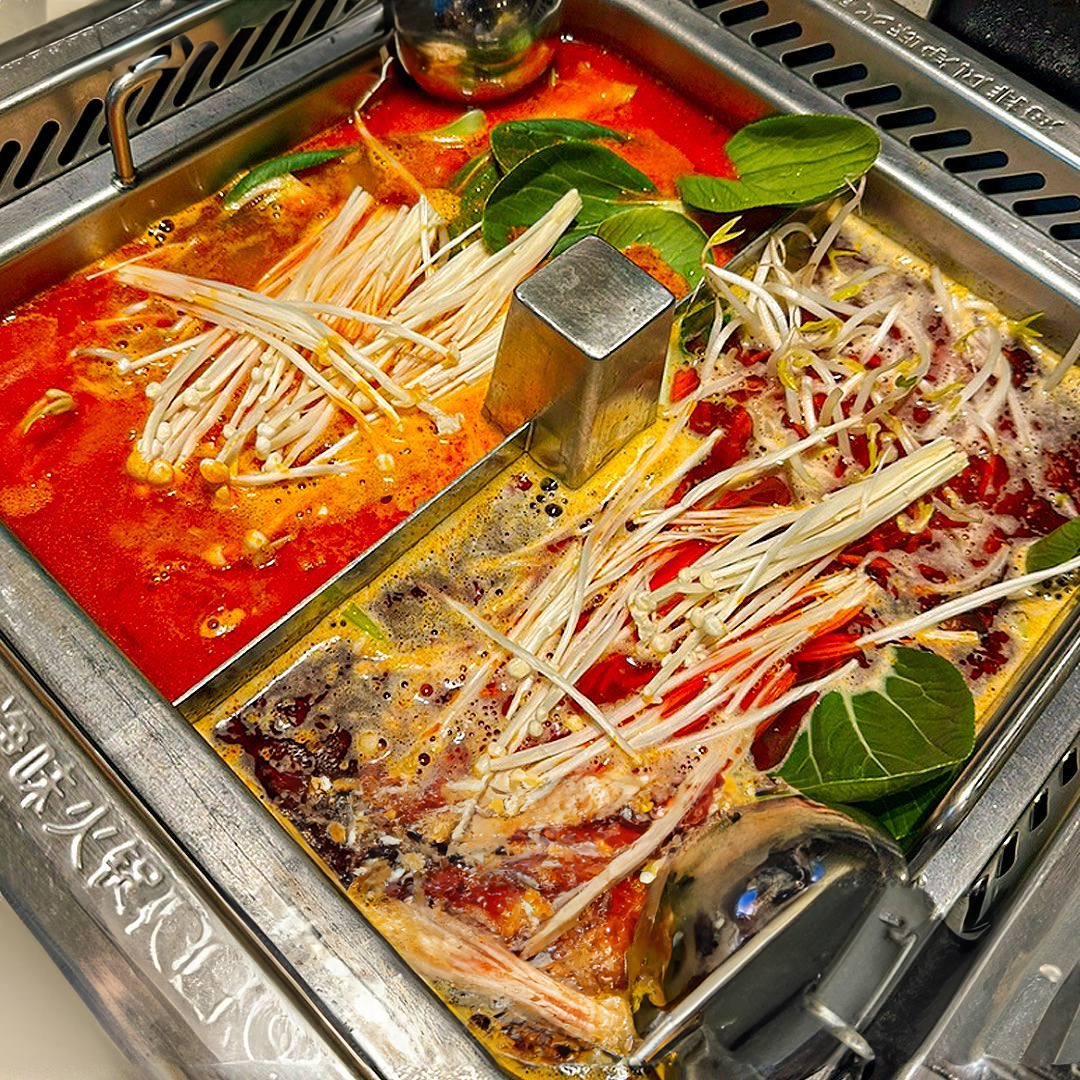 Bright exterior and nighttime atmosphere of Haidilao Gondeok Branch near Gondeok Station