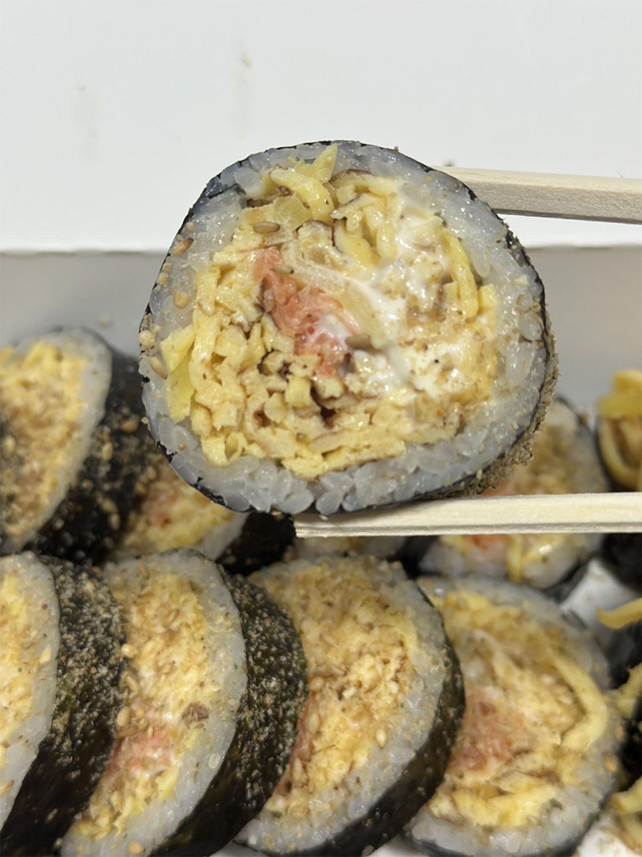 Freshly made egg gimbap packed neatly from Terra Gimbap in Hongdae