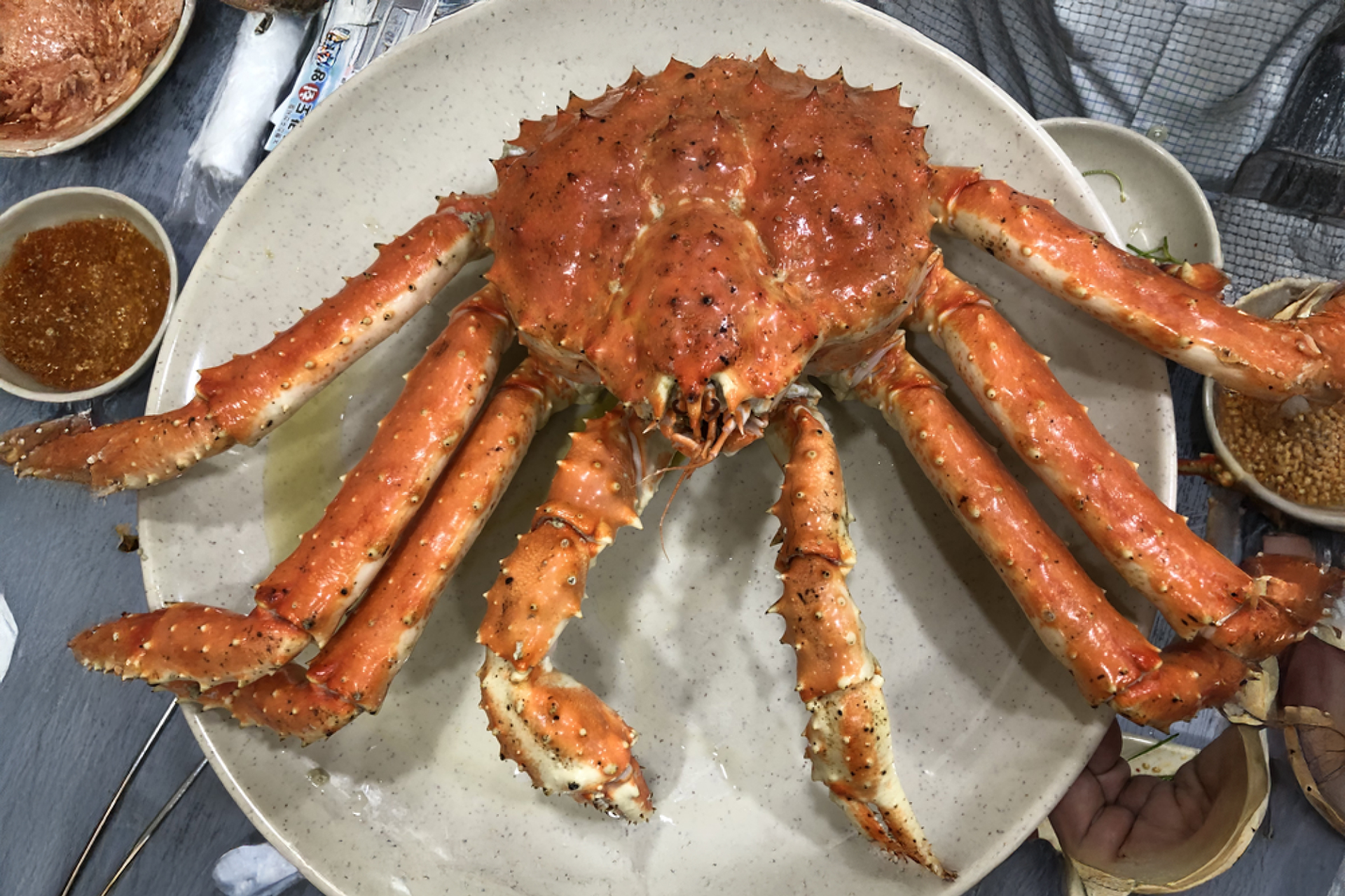 Savory fried rice served inside a king crab shell mixed with crab innards and seaweed