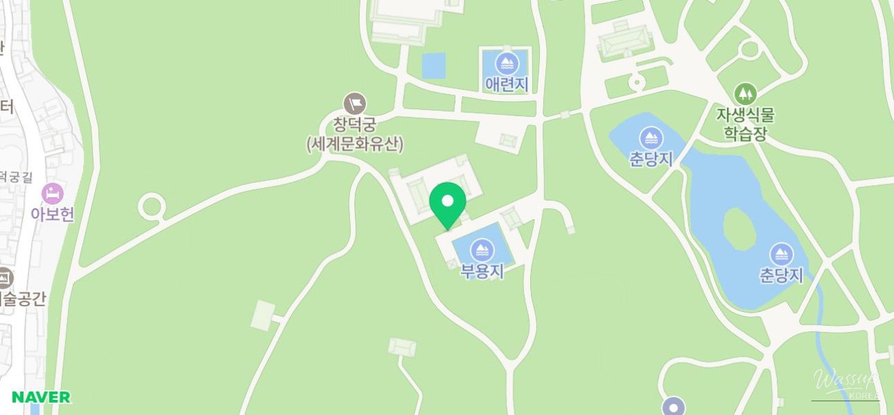 Traditional architectural details of the palace roofs against a clear blue sky