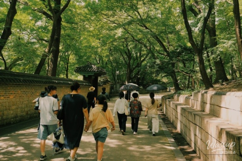 A serene view of the Juhamnu Pavilion reflecting on the clear waters of Buyongji Pond