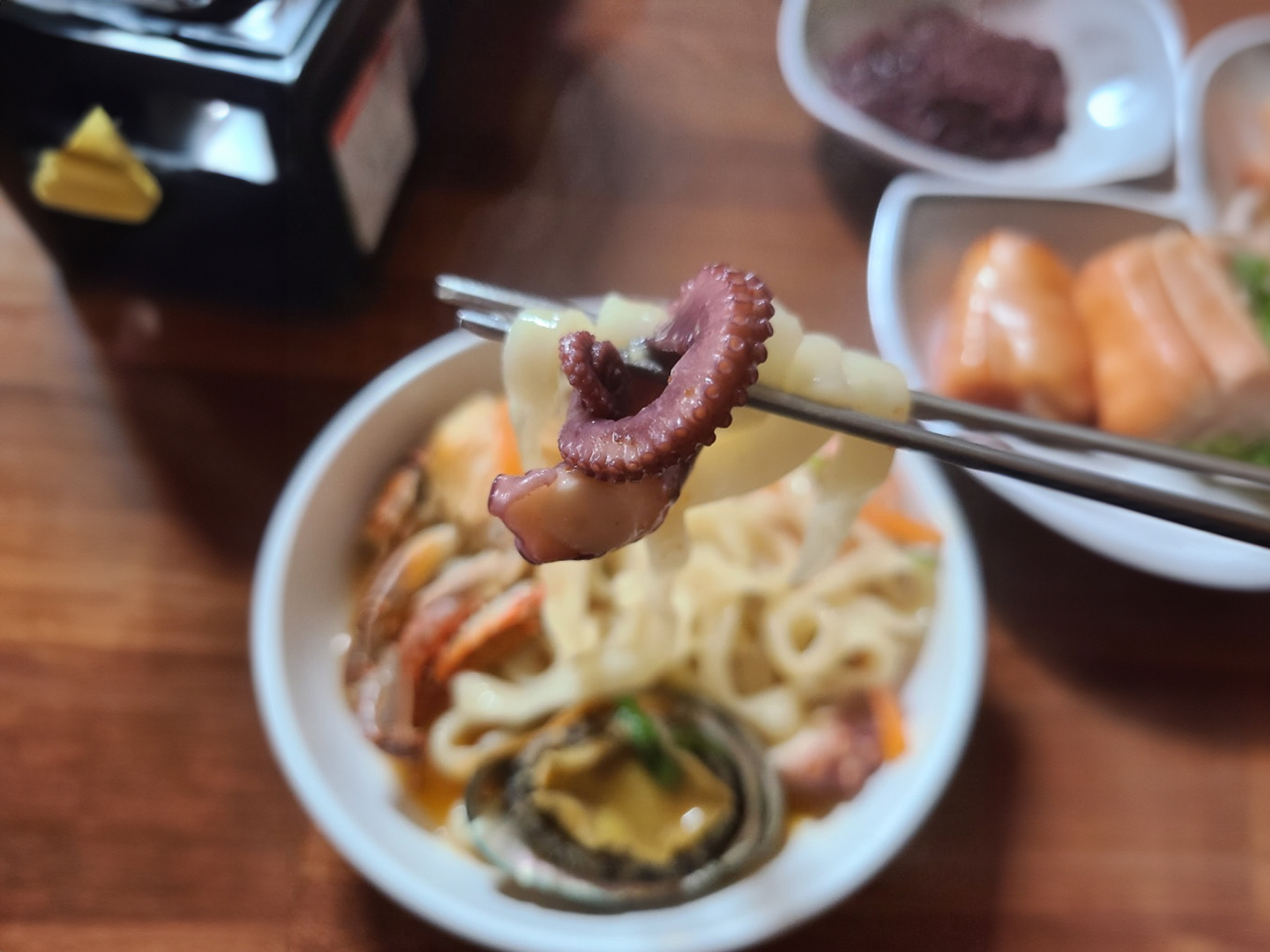 King dumplings and seafood noodle dishes served at a Jeju restaurant
