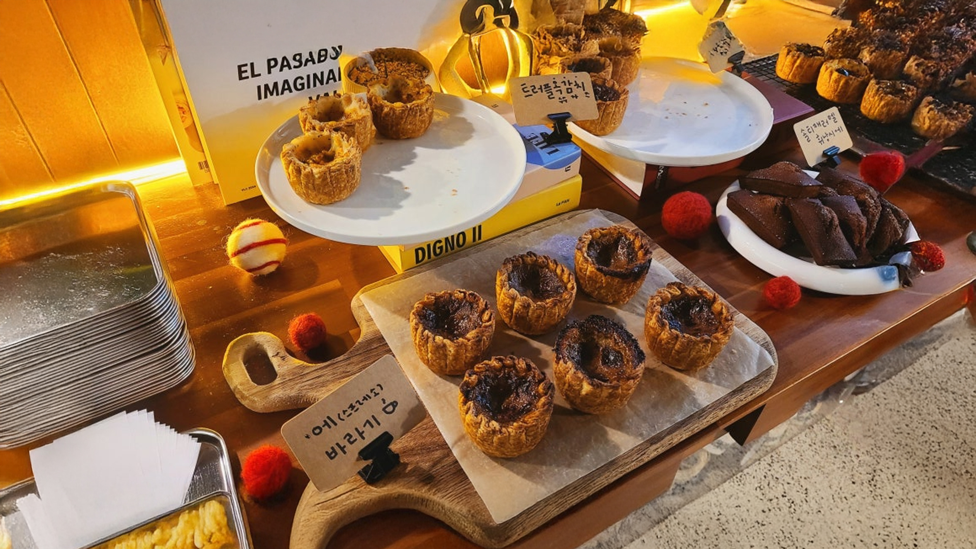 A variety of freshly baked egg tarts displayed at Scruffy cafe