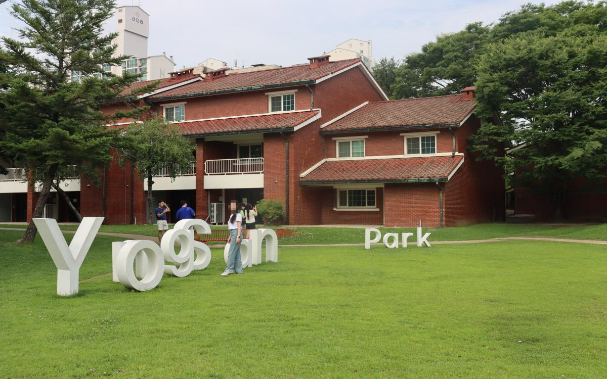 A panoramic view of Seoul's skyline at sunset featuring the Han River and Nodeul Island
