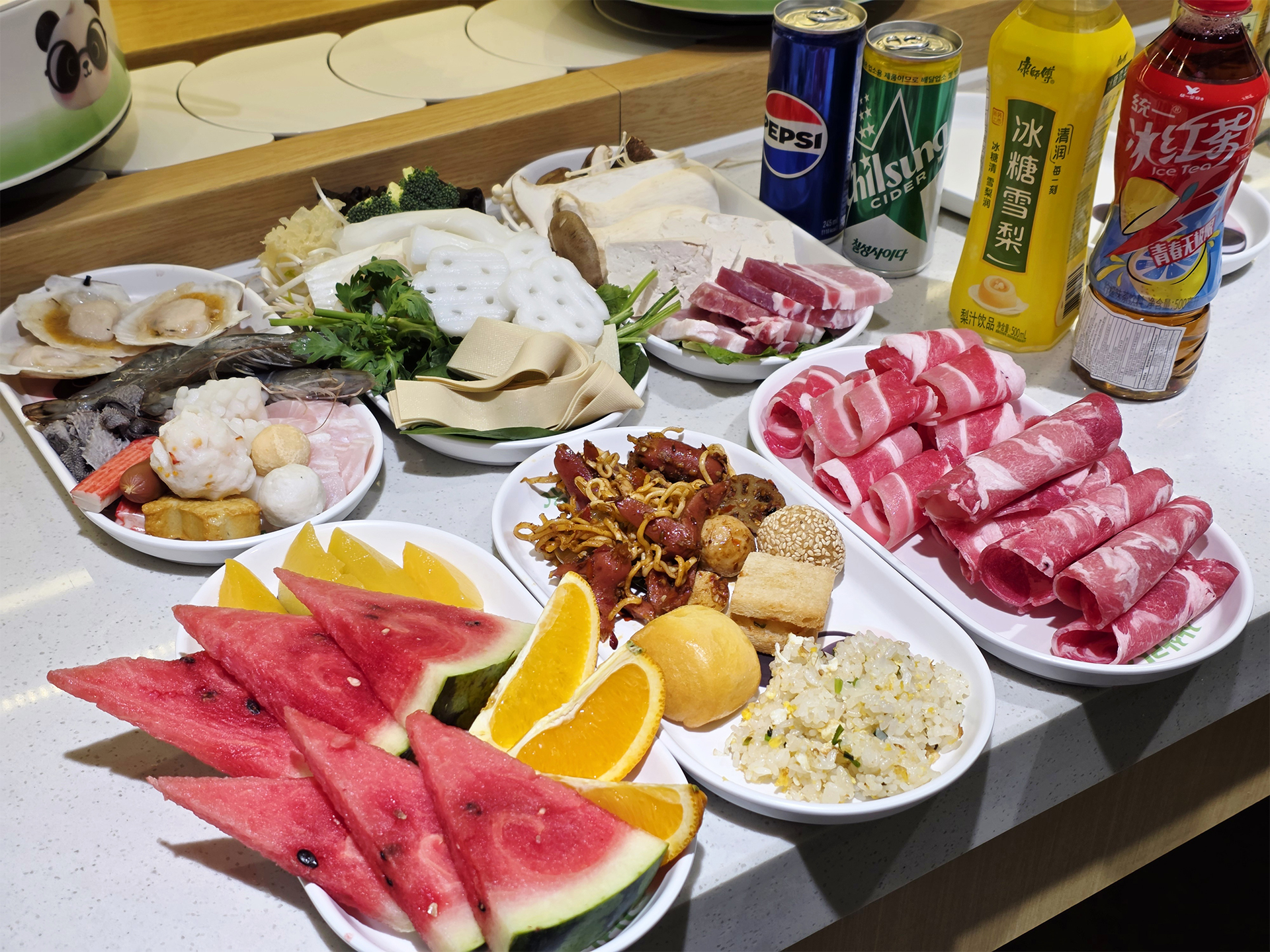 Interior view showing rotating ingredient rails inside the Gundae hot pot restaurant
