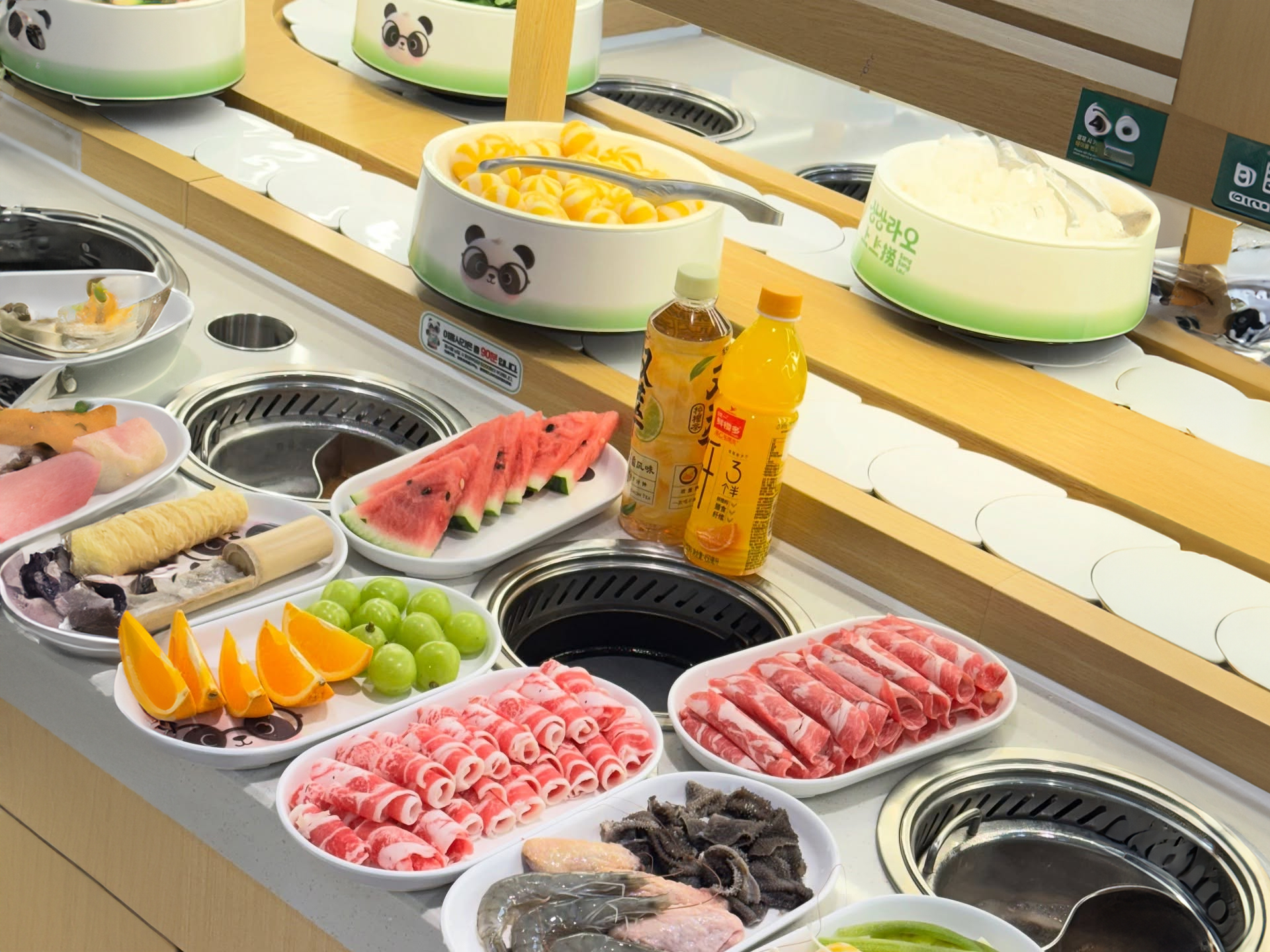 Personal hot pot and grill setup with half-and-half broth selection