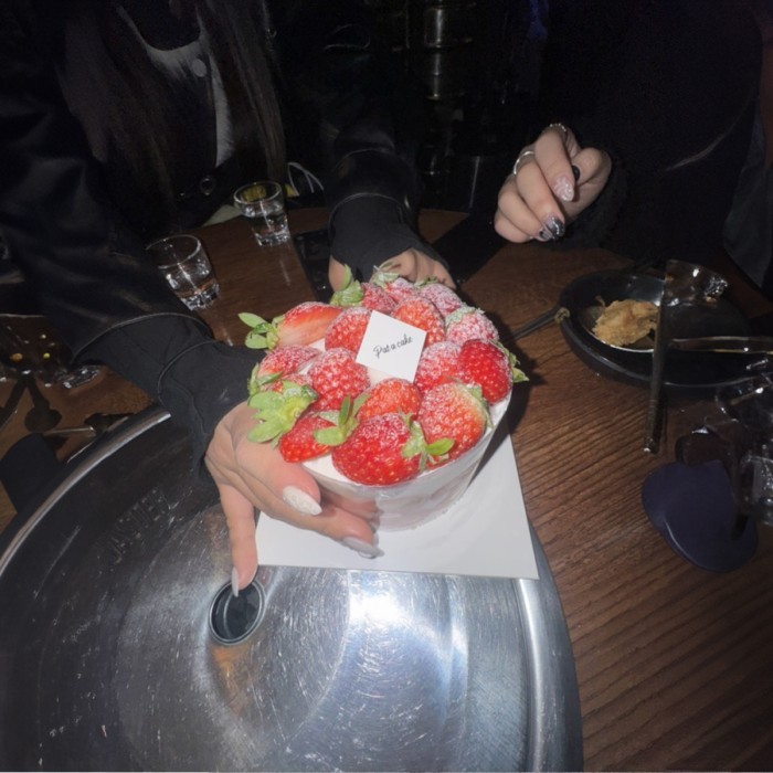 Casual night scene near a performance venue in Hongdae with diary-like moments