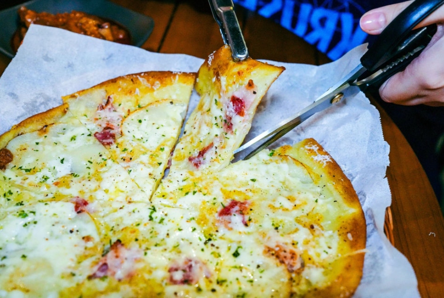 Warm bowl of kalguksu with clear anchovy broth and vegetables.